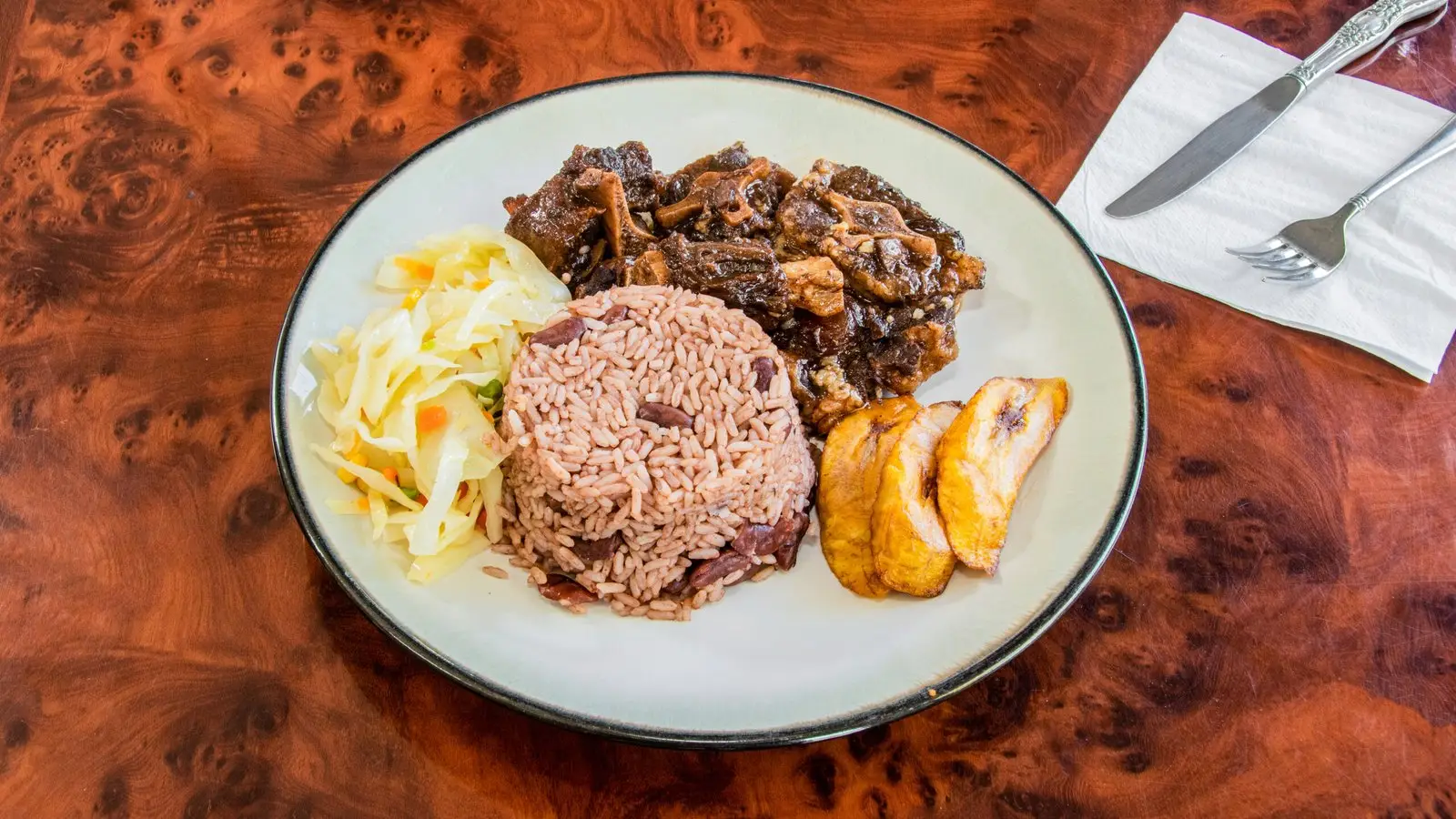 Oxtail in gravy served over rice from Nice and Knuff
